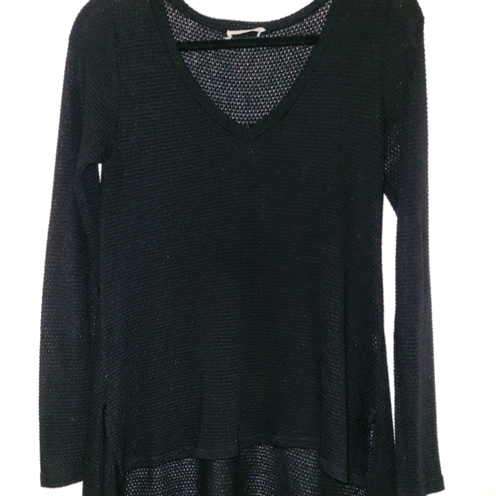 black asymmetrical hemline sweater. Very flattering.